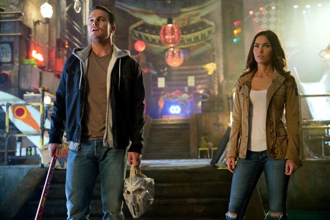 Left to right: Stephen Amell as Casey Jones and Megan Fox as April O'Neil in Teenage Mutant Ninja Turtles: Out of the Shadows from Paramount Pictures, Nickelodeon Movies and Platinum Dunes Productions