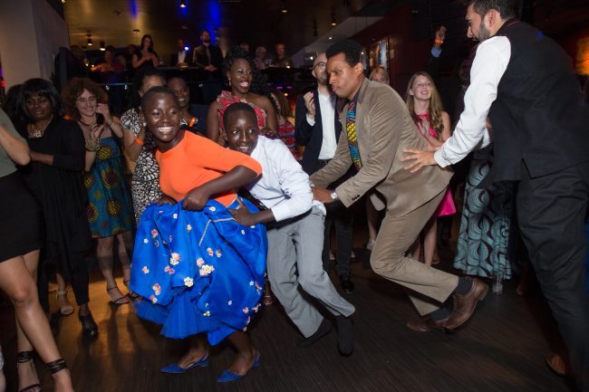 Madina Nalwanga and Martin Kabanza dances with Disney's Tendo Nagenda dance at the U.S. premiere of Disney's Queen of Katwe at the El Capitan Theatre in Hollywood, CA on Tuesday, September 20, 2016. The film, starring David Oyelowo, Oscar winner Lupita NyongÕo and newcomer Madina Nalwanga, is directed by Mira Nair and opens in U.S. theaters in limited release on September 23, expanding wide September 30, 2016...(Photo: Alex J. Berliner/ABImages)